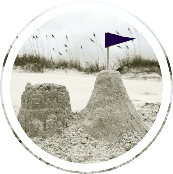 A sandcastle with a flag on a Florida beach